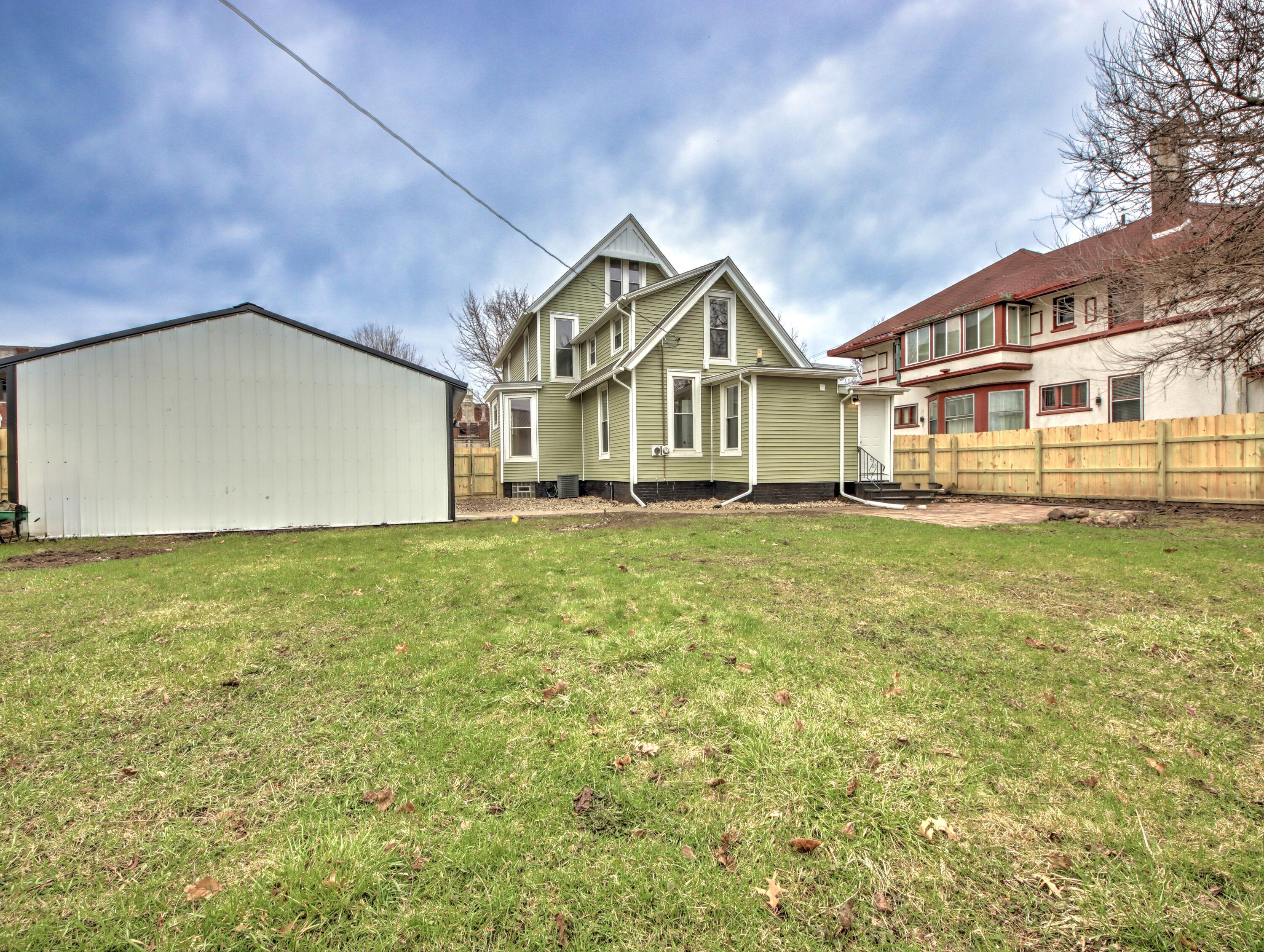 1005 Harrison Street La Porte, IN 46350 - Photo 48 of 54 a front view of a house with a yard and fountain