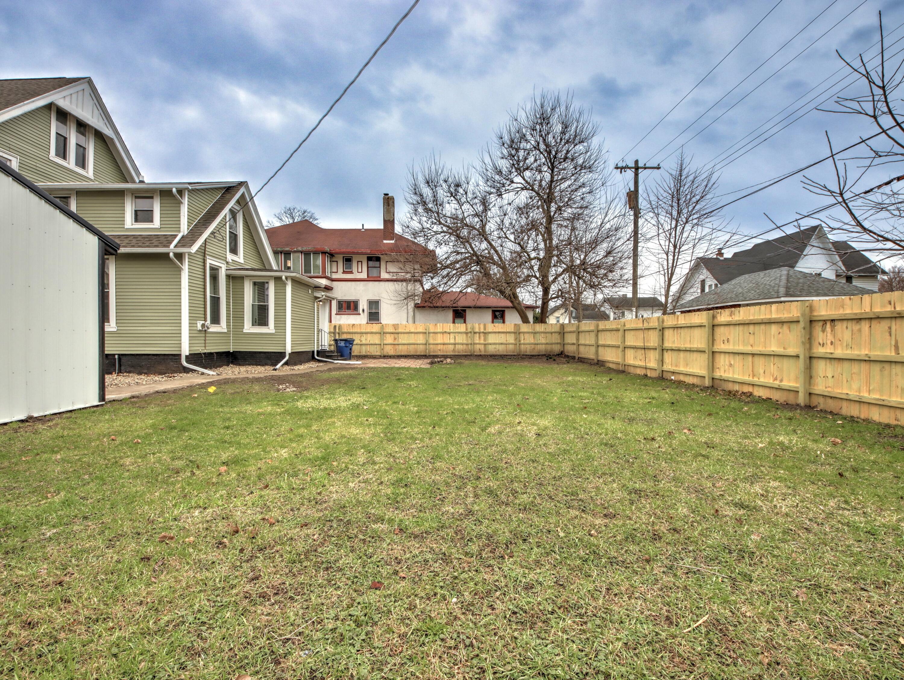 1005 Harrison Street La Porte, IN 46350 - Photo 49 of 54 a front view of a house with a yard table and chairs