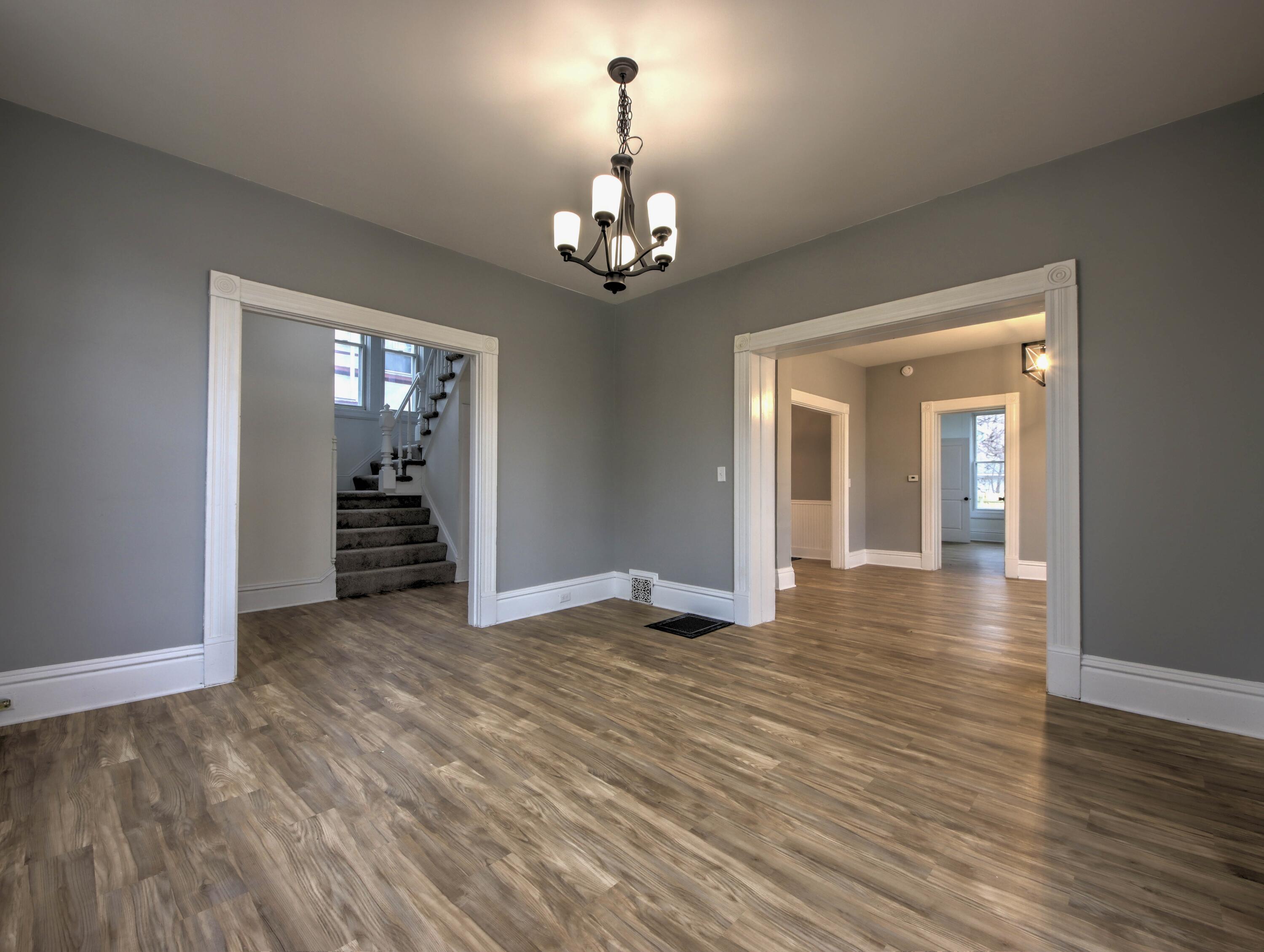 1005 Harrison Street La Porte, IN 46350 - Photo 7 of 54 wooden floor in an empty room with a window