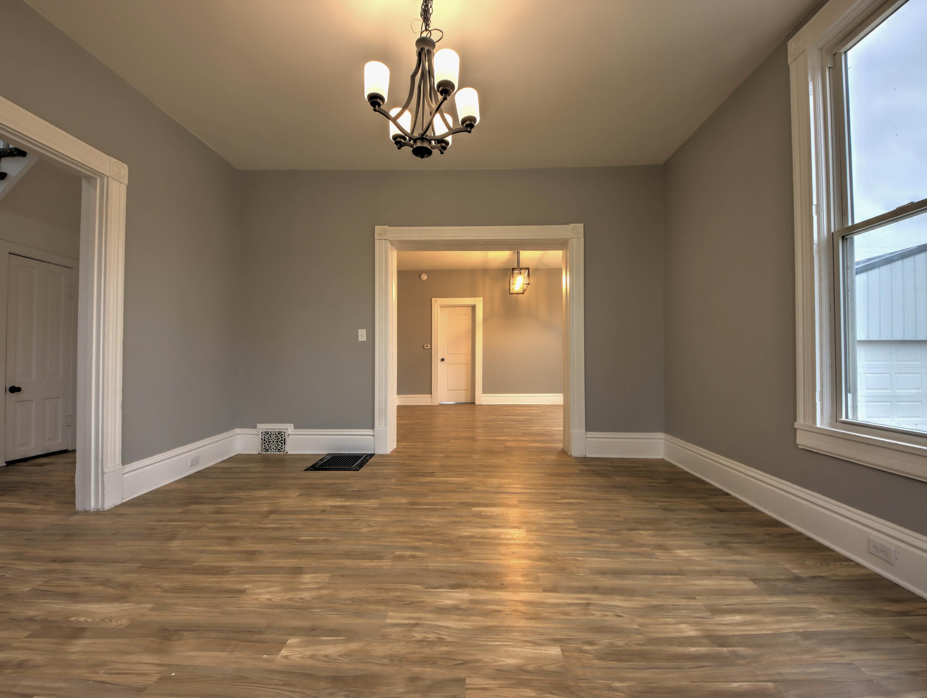 1005 Harrison Street La Porte, IN 46350 - Photo 8 of 54 a view of empty room with wooden floor and window