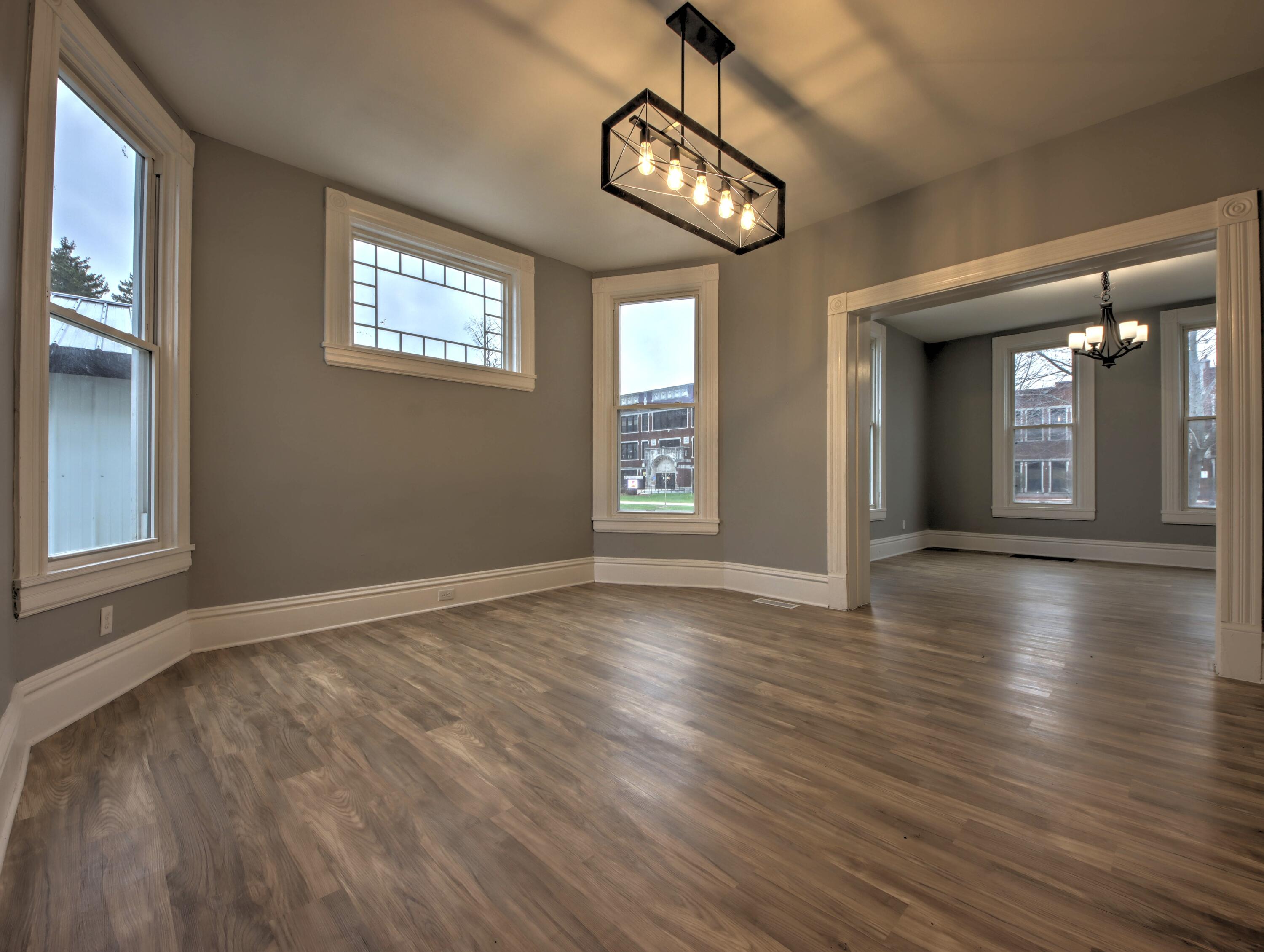 1005 Harrison Street La Porte, IN 46350 - Photo 9 of 54 a view of an empty room with wooden floor and a window