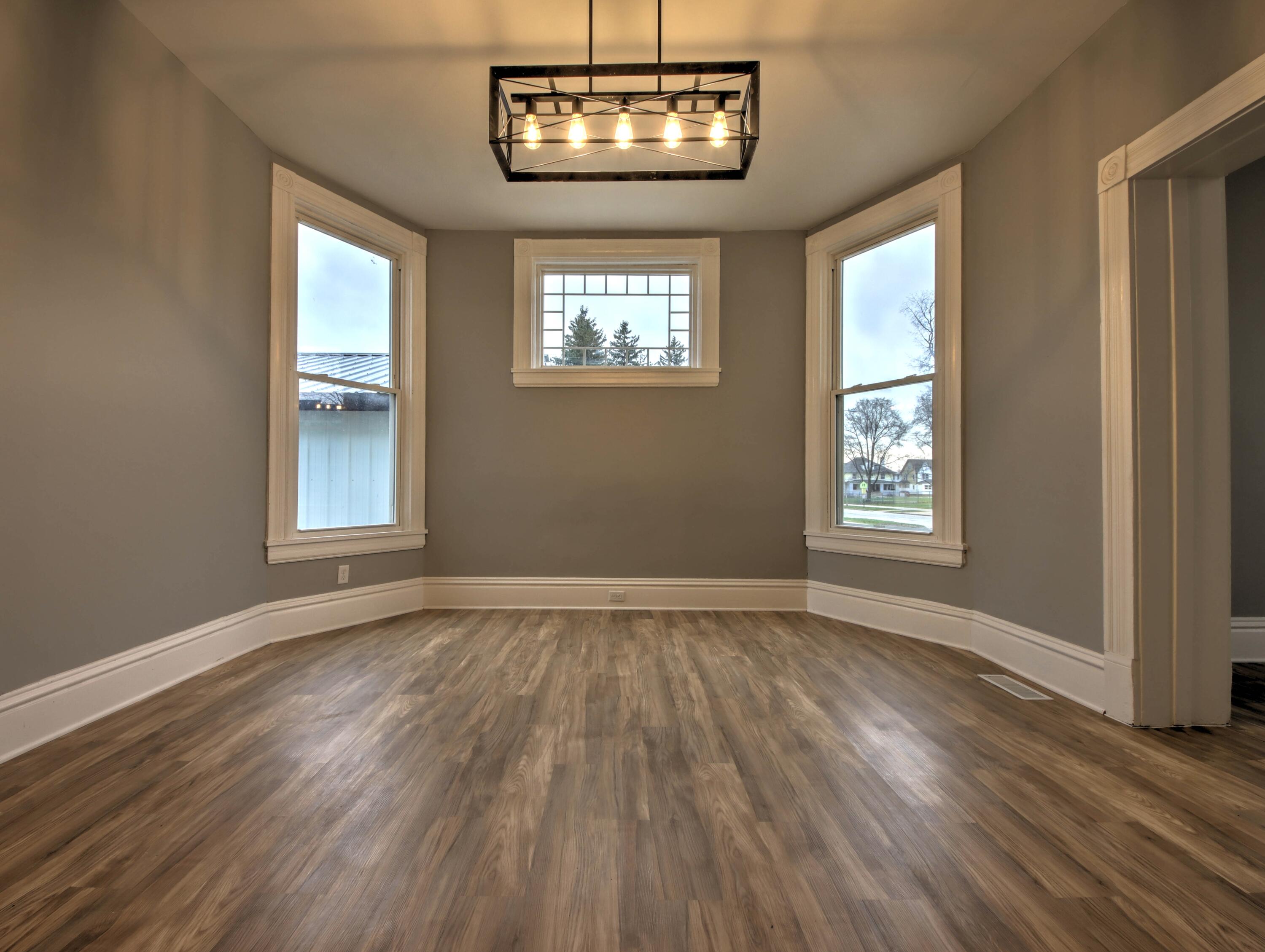 1005 Harrison Street La Porte, IN 46350 - Photo 10 of 54 a view of an empty room with wooden floor and a window