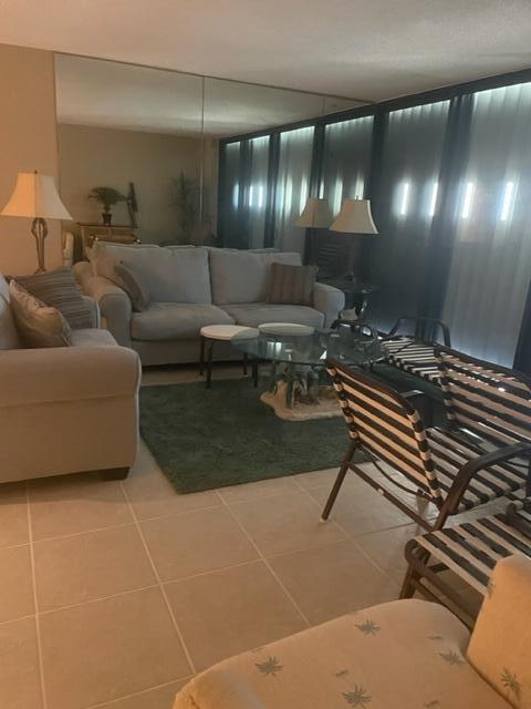 2000 Coco Plum Drive, Unit 1206 Marathon, FL 33050 - Photo 11 of 21 a lobby with furniture and a potted plant
