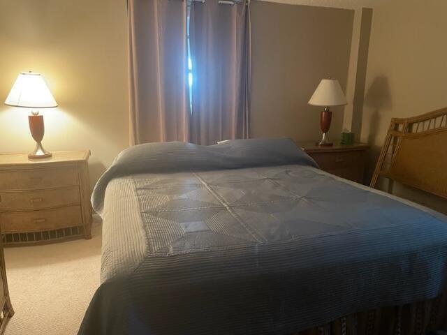 2000 Coco Plum Drive, Unit 1206 Marathon, FL 33050 - Photo 14 of 21 a bedroom with a bed and a lamp