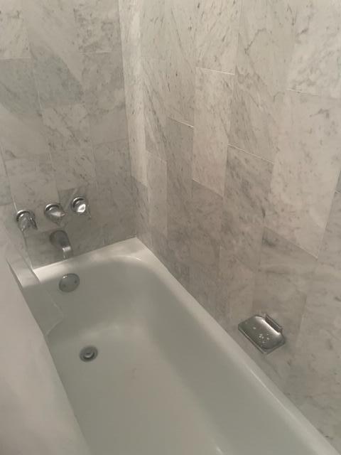 2000 Coco Plum Drive, Unit 1206 Marathon, FL 33050 - Photo 16 of 21 a bathroom with a tub
