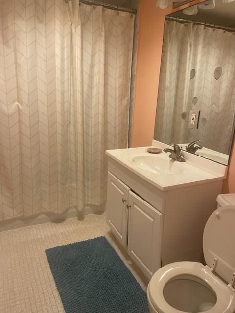 2000 Coco Plum Drive, Unit 1206 Marathon, FL 33050 - Photo 18 of 21 a bathroom with a sink a toilet and shower