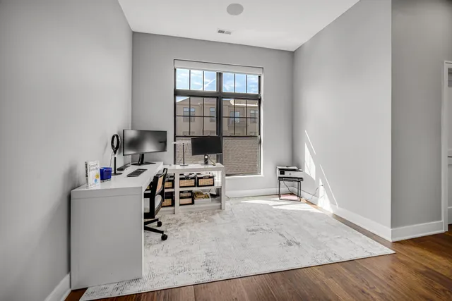 a view of multiple houses with a street