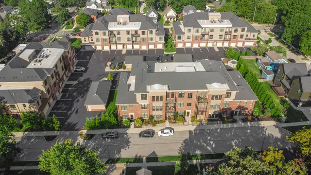 a view of a house with roof deck and sitting area