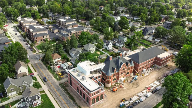 a city street lined with buildings and trees