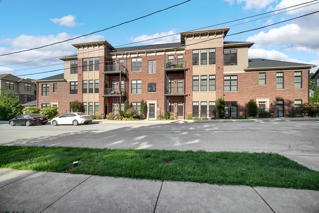 a view of a patio with table and chairs with wooden floor and fence
