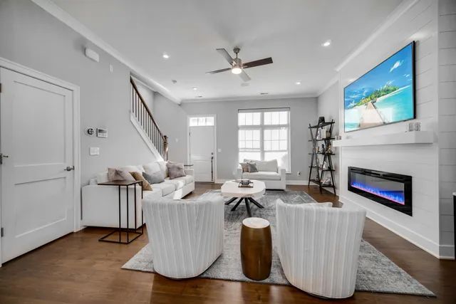 a kitchen with stainless steel appliances kitchen island granite countertop a table chairs a sink dishwasher and cabinets