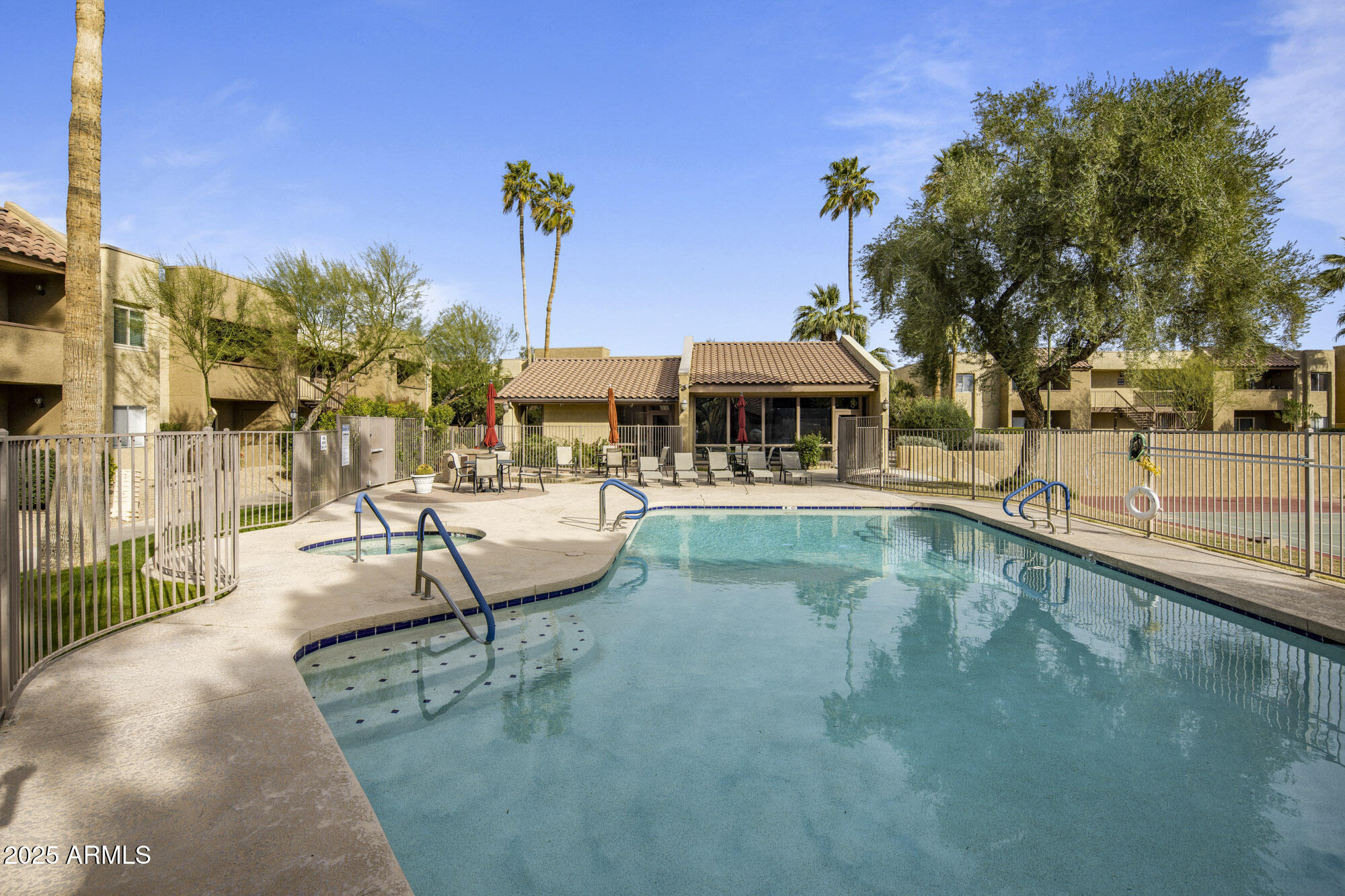 5877 North Granite Reef Road, Unit 2212 Scottsdale, AZ 85250 - Photo 13 of 16 a view of a swimming pool with a patio