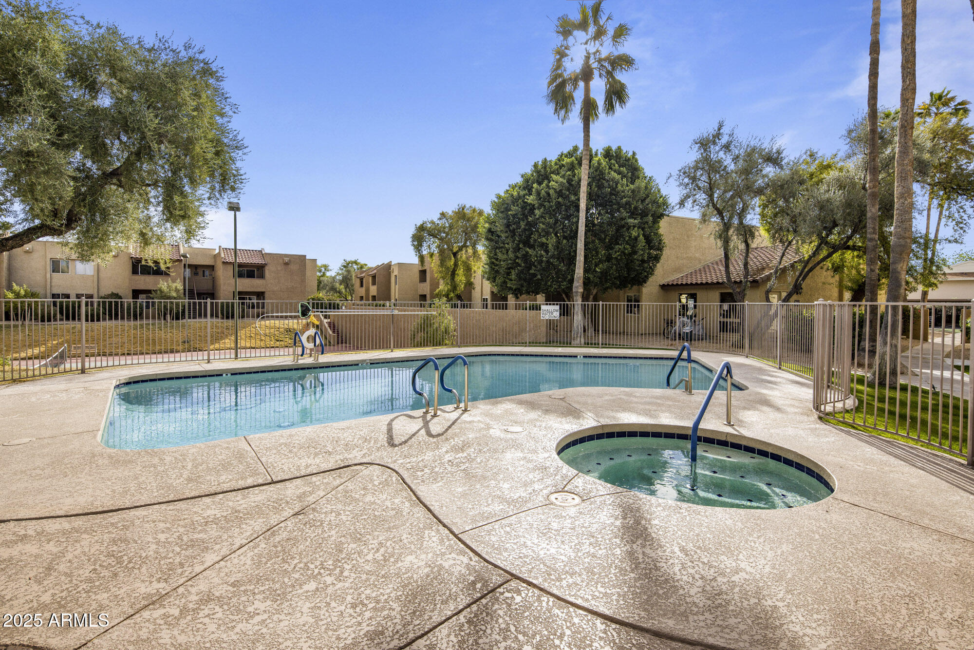 5877 North Granite Reef Road, Unit 2212 Scottsdale, AZ 85250 - Photo 14 of 16 a view of a swimming pool with a patio