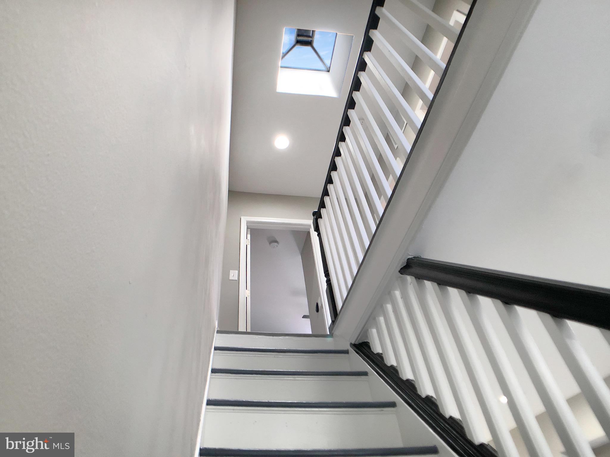 1111 Bayard Street Baltimore, MD 21223 - Photo 14 of 39 a view of staircase with railing and white walls