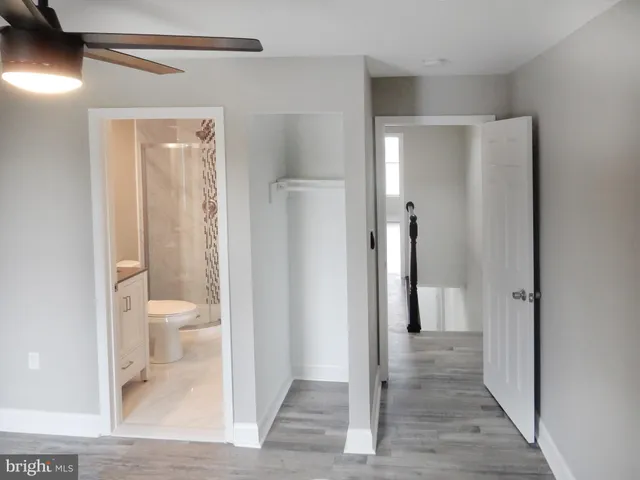 a view of a bathroom from a hallway