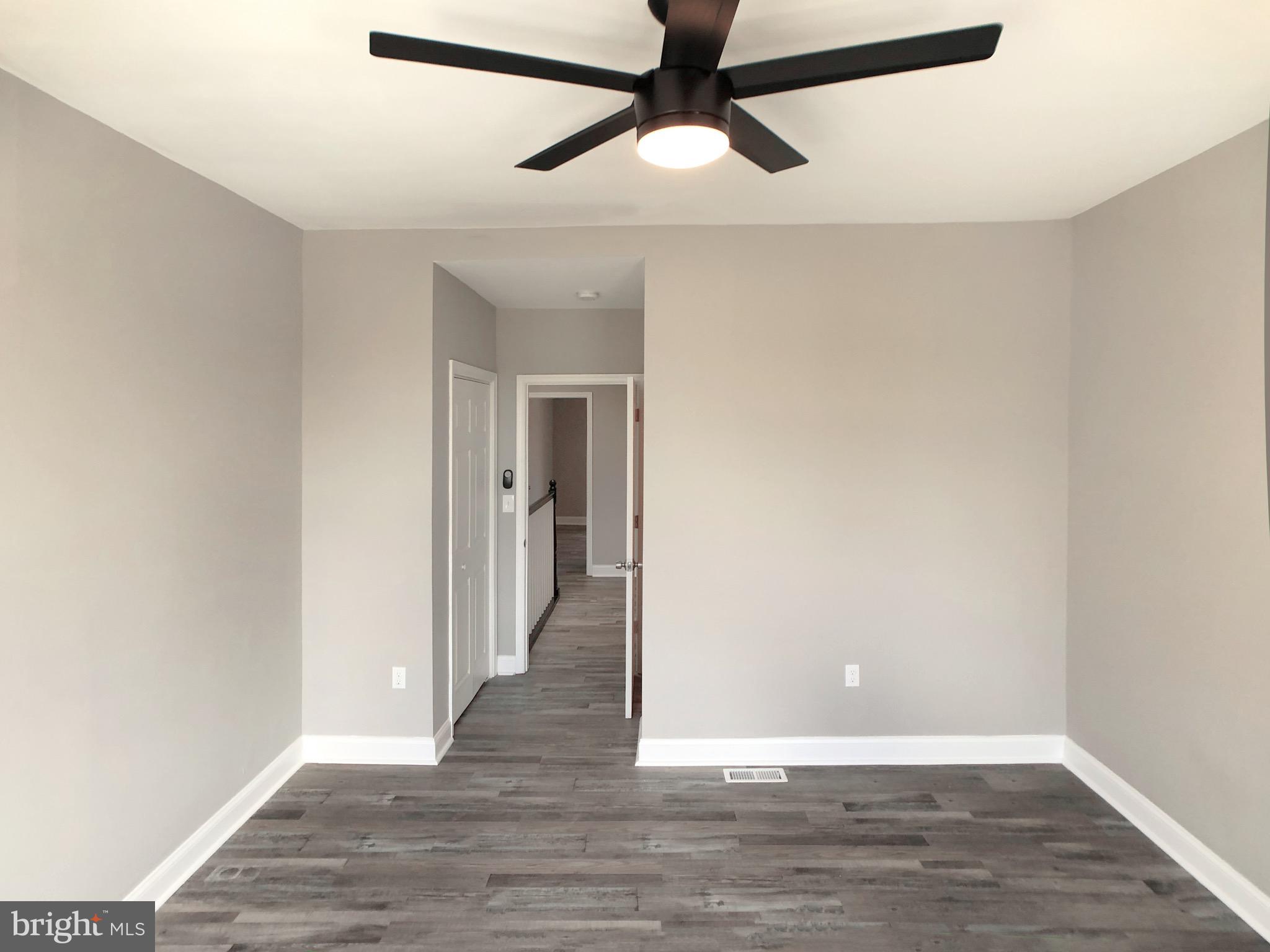 1111 Bayard Street Baltimore, MD 21223 - Photo 23 of 39 a view of a hallway with wooden floor