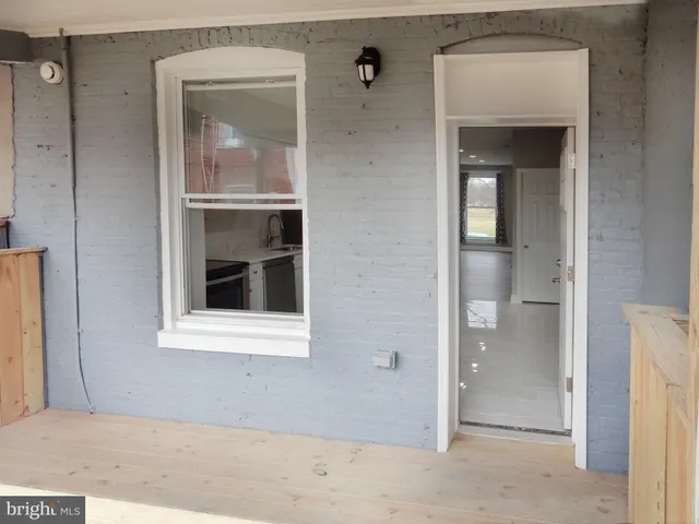 a view of a balcony with wooden floor