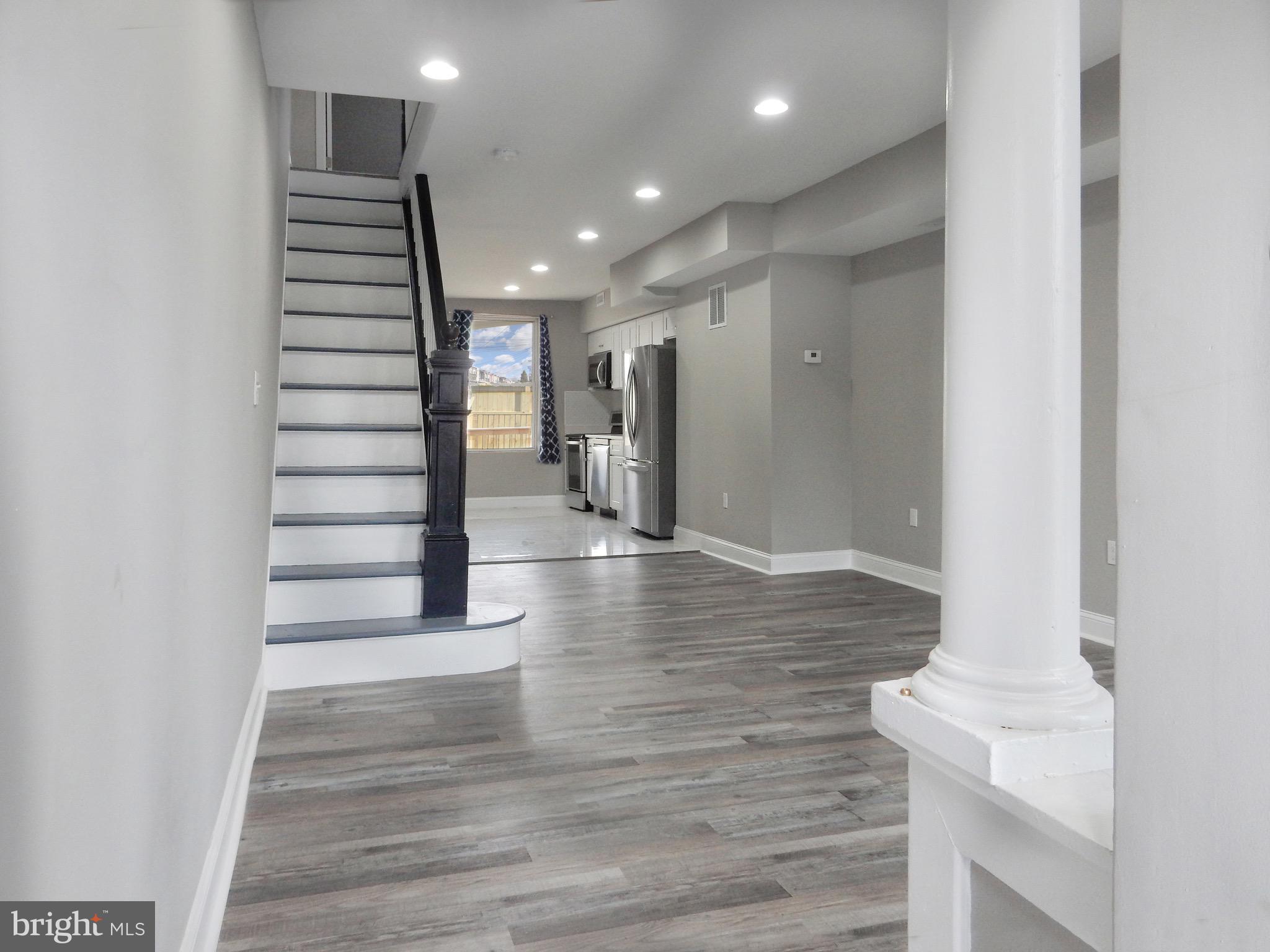 1111 Bayard Street Baltimore, MD 21223 - Photo 5 of 39 a view of entryway and hall with wooden floor