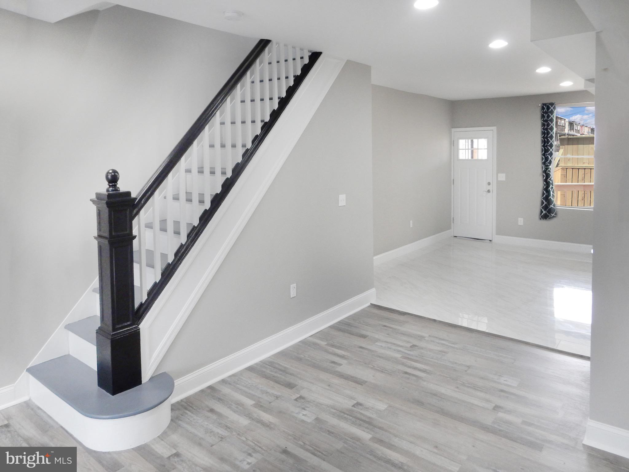 1111 Bayard Street Baltimore, MD 21223 - Photo 6 of 39 a view of an entryway with wooden floor