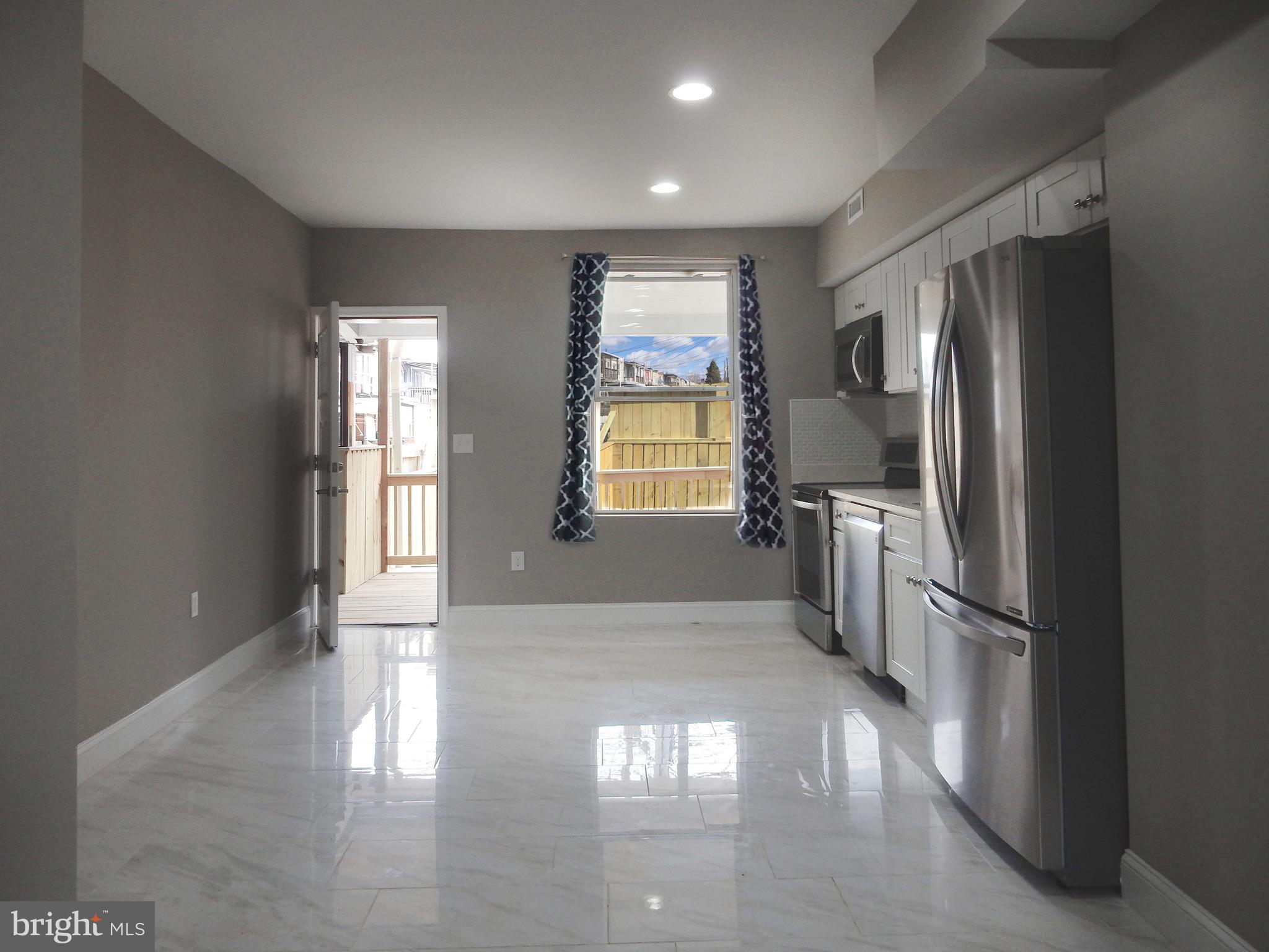 1111 Bayard Street Baltimore, MD 21223 - Photo 10 of 39 a view of entryway with wooden floor