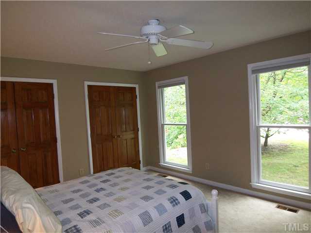 2804 Poplar Grove Court Raleigh, NC 27613 - Photo 8 of 20 a bedroom with a bed and a window