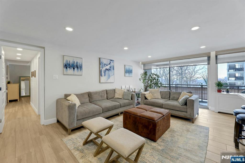 2 Horizon Road, Unit G1 Fort Lee, NJ 07024 - Photo 13 of 44 a living room with furniture and a large window
