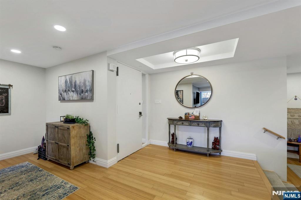 2 Horizon Road, Unit G1 Fort Lee, NJ 07024 - Photo 18 of 44 a view of a livingroom with furniture wooden floor and a ceiling fan