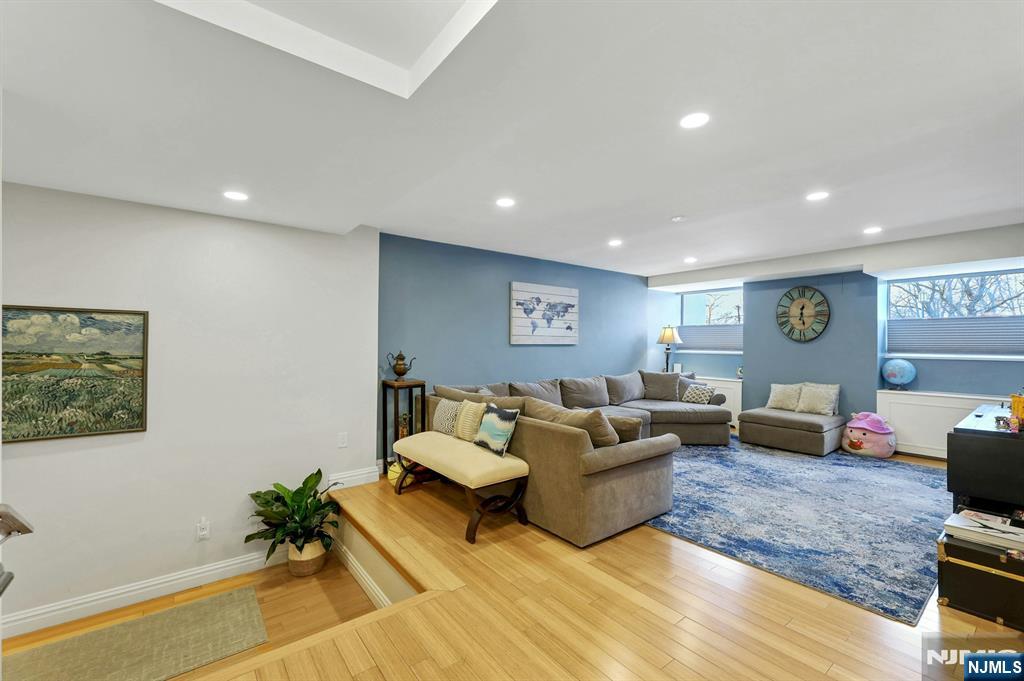 2 Horizon Road, Unit G1 Fort Lee, NJ 07024 - Photo 20 of 44 a living room with furniture and a wooden floor