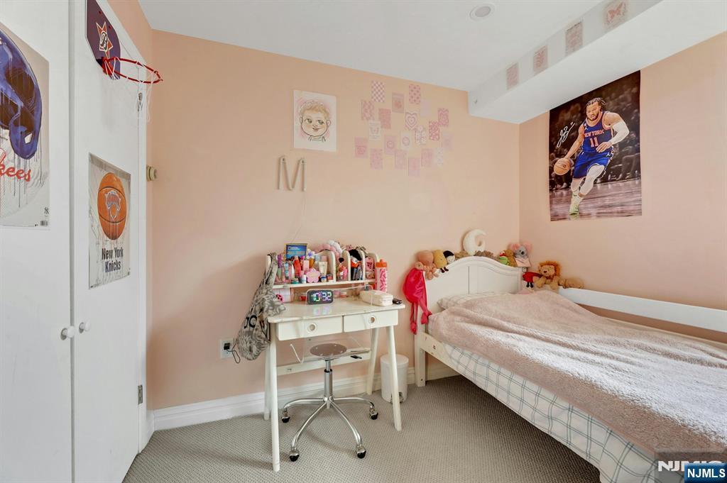 2 Horizon Road, Unit G1 Fort Lee, NJ 07024 - Photo 24 of 44 a bedroom with a bed and furniture