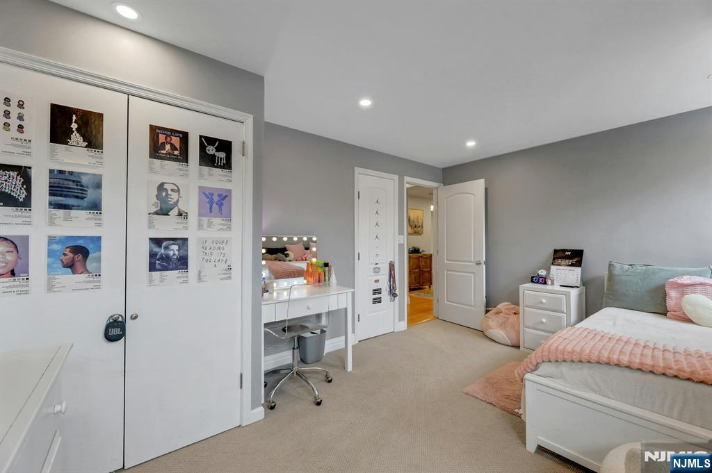 2 Horizon Road, Unit G1 Fort Lee, NJ 07024 - Photo 26 of 44 a bedroom with furniture and baby bed