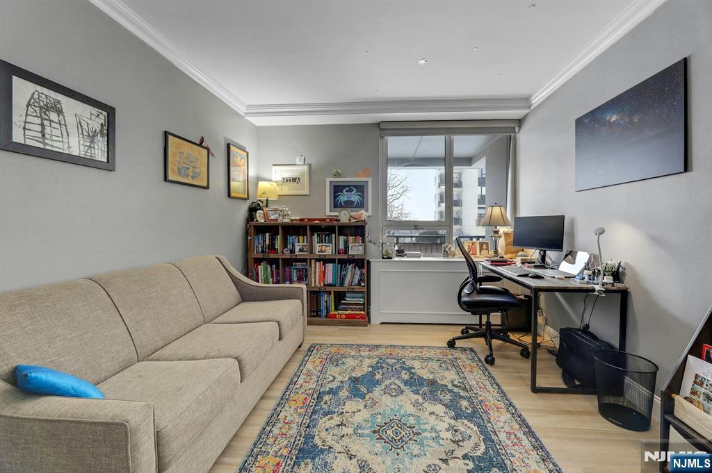 2 Horizon Road, Unit G1 Fort Lee, NJ 07024 - Photo 30 of 44 a living room with furniture and a flat screen tv