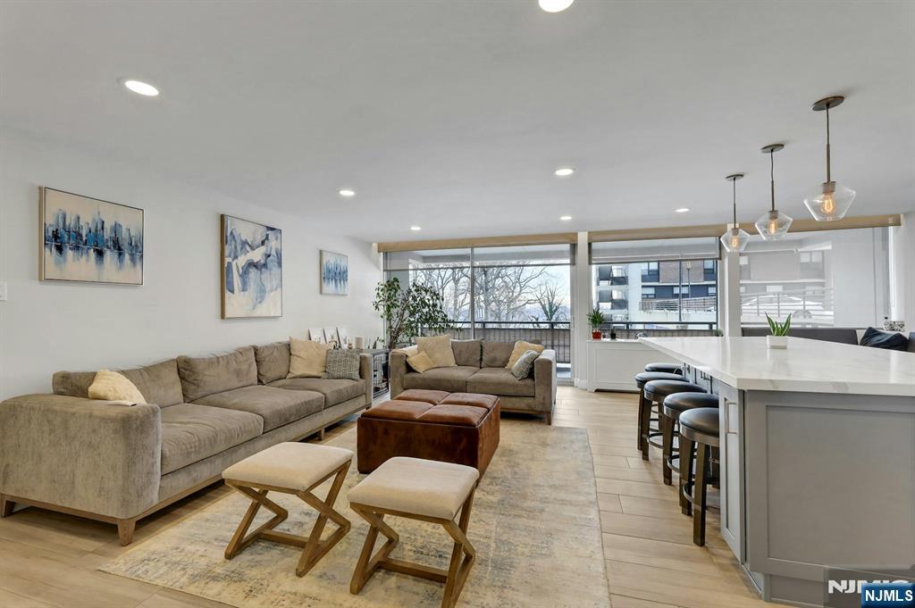 2 Horizon Road, Unit G1 Fort Lee, NJ 07024 - Photo 3 of 44 a living room with furniture and a large window