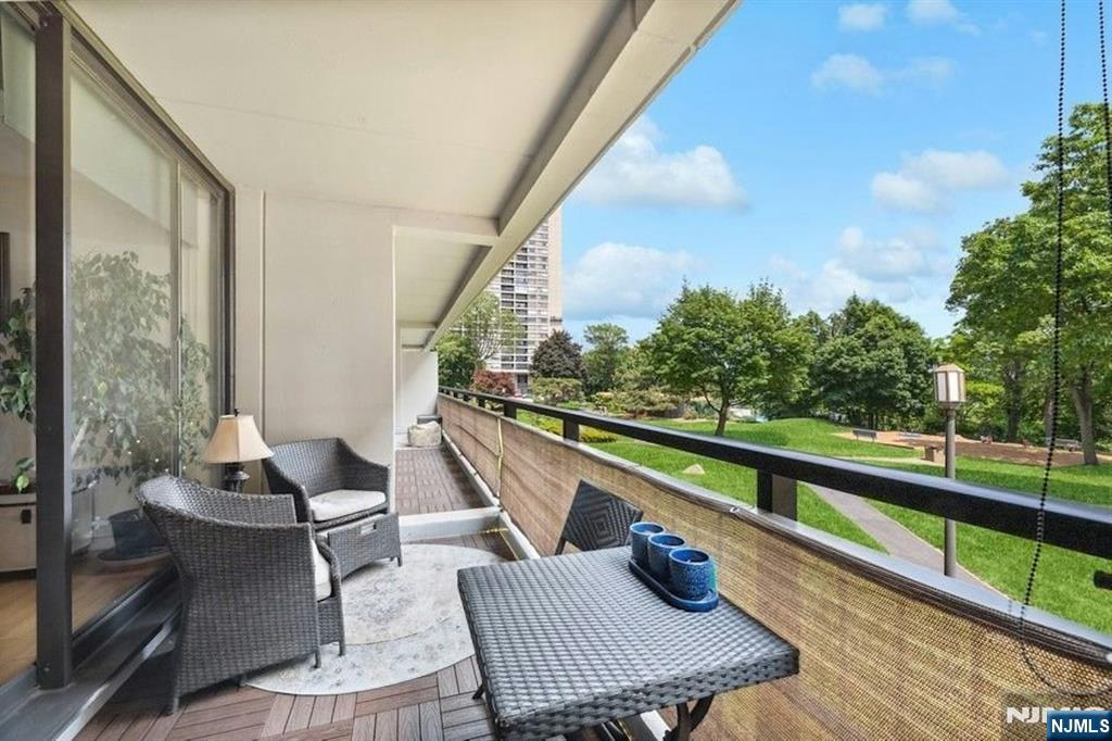 2 Horizon Road, Unit G1 Fort Lee, NJ 07024 - Photo 4 of 44 a view of balcony with couch and chairs