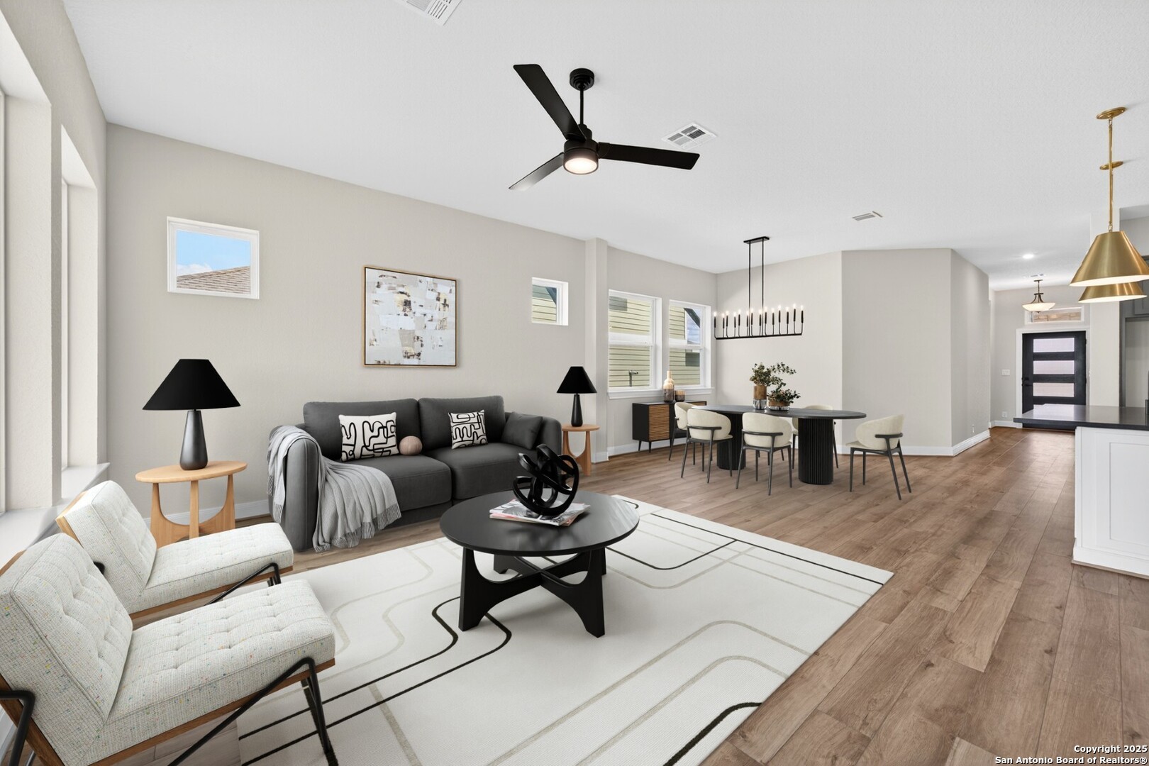 8203 Wellstone Schertz, TX 78154 - Photo 12 of 33 a living room with furniture and a wooden floor