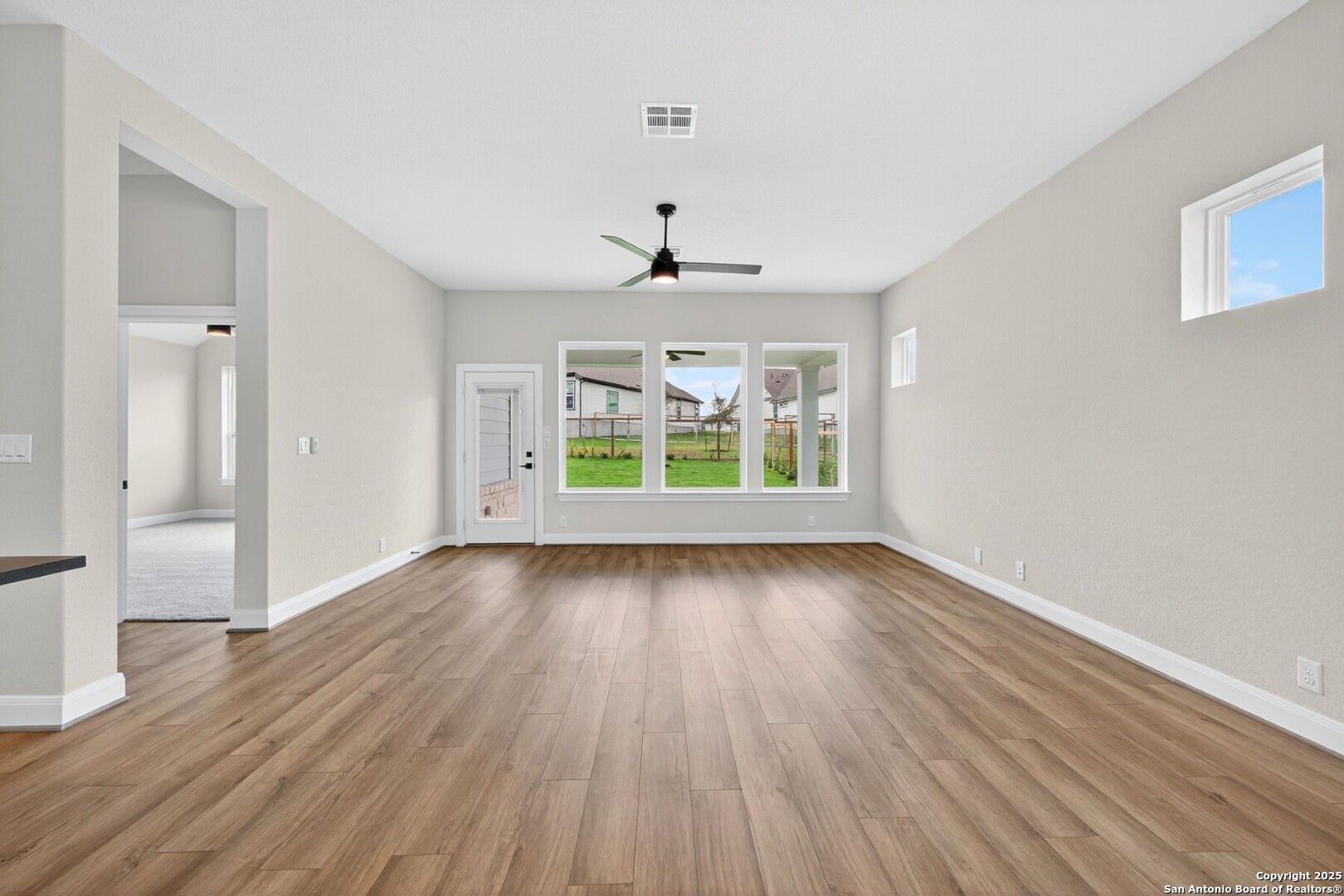 8203 Wellstone Schertz, TX 78154 - Photo 18 of 33 wooden floor in an empty room with a window