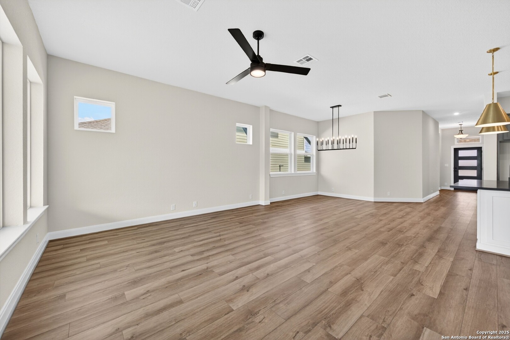 8203 Wellstone Schertz, TX 78154 - Photo 22 of 33 a view of empty room with wooden floor