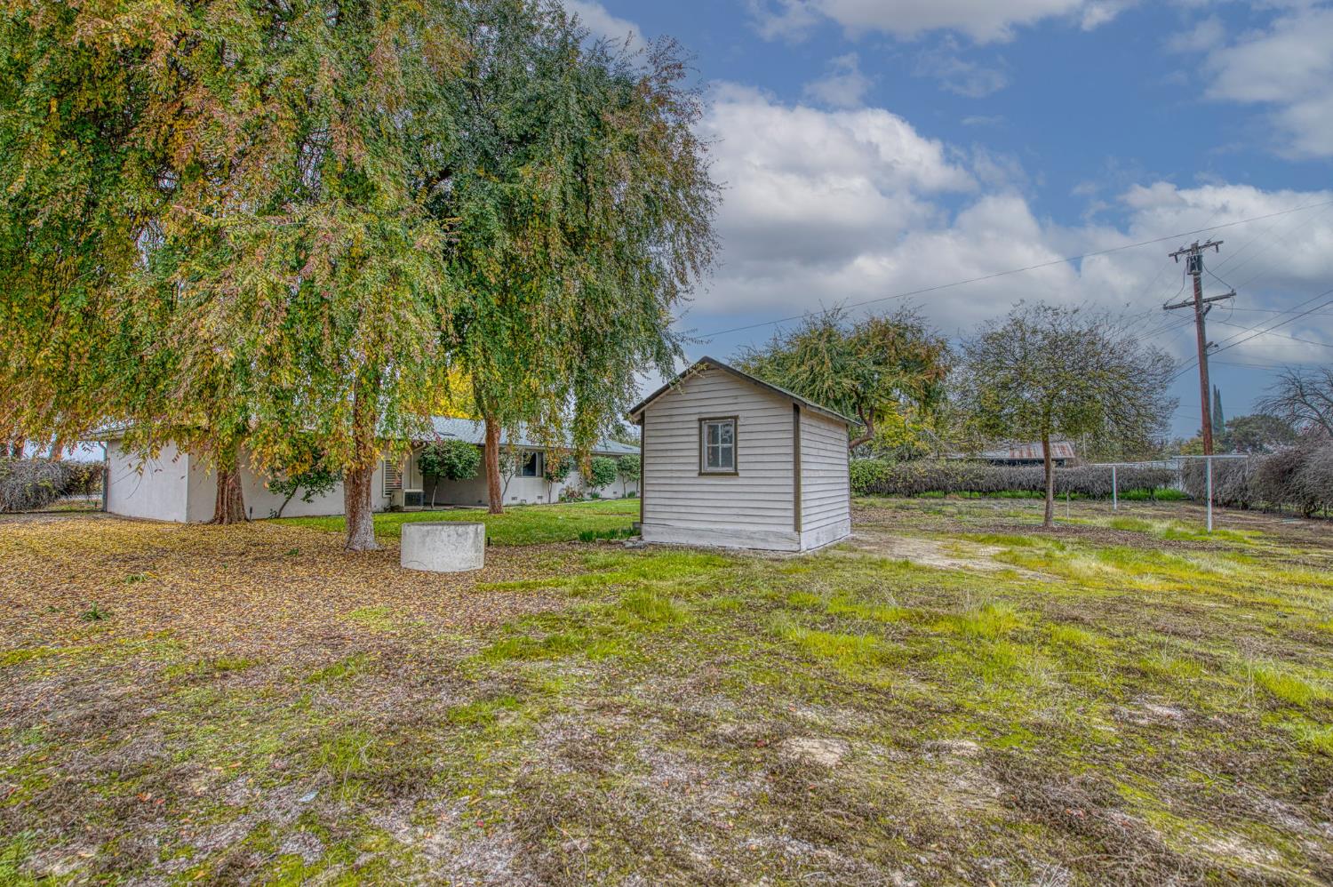 13130 South Henderson Road Caruthers, CA 93609 - Photo 33 of 36 a view of a house with a yard