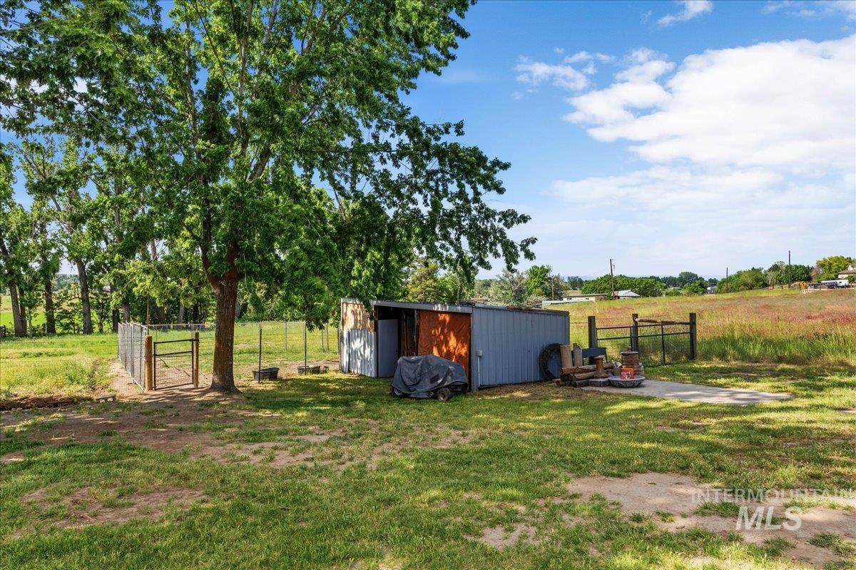 6323 Foothill Road Star, ID 83669 - Photo 31 of 50 Expansive outdoor space featuring a mature tree, a metal storage shed, and a concrete pad
