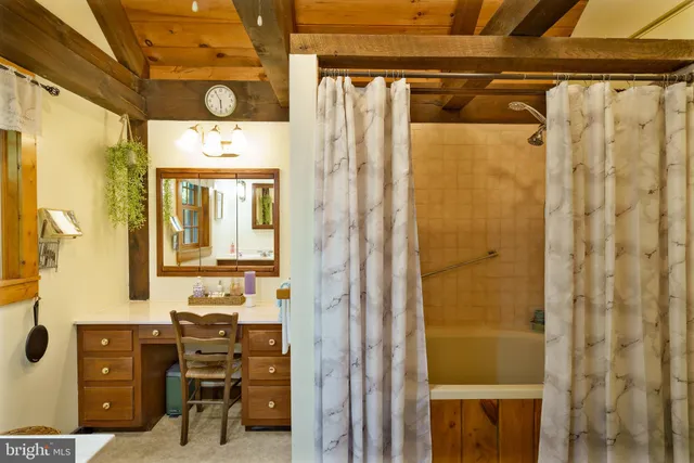 a bathroom with a toilet sink and shower