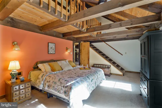 a view of a room with a table and chairs