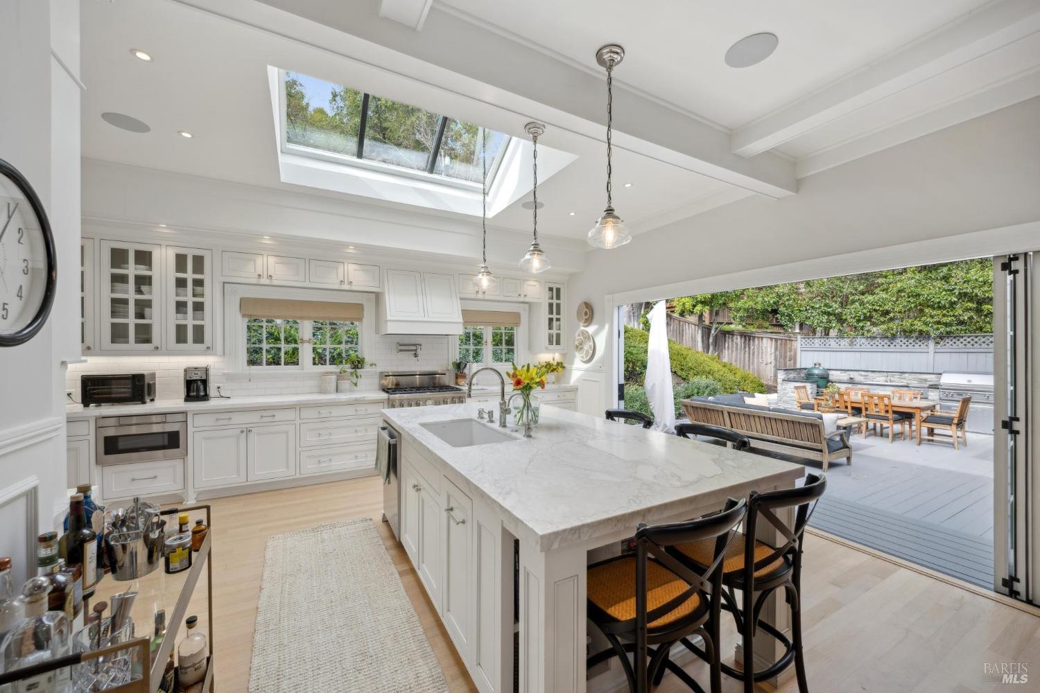 2 Foothill Road San Anselmo, CA 94960 - Photo 1 of 1 a kitchen with stainless steel appliances granite countertop sink stove and wooden cabinets