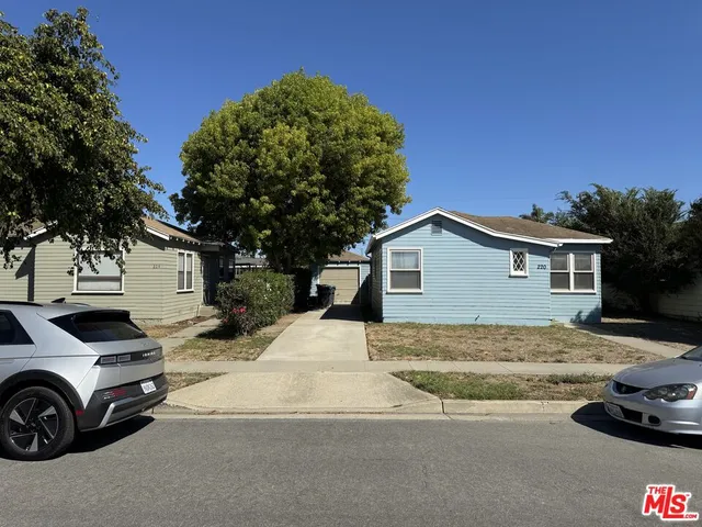 a view of a car parked in front of a house