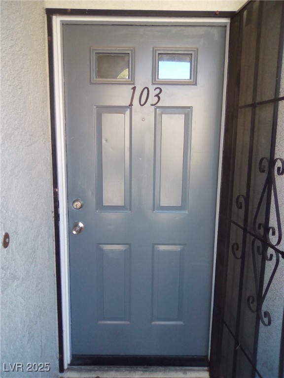 4830 Nara Vista Way, Unit 103 Las Vegas, NV 89103 - Photo 3 of 20 View of exterior entry with stucco siding