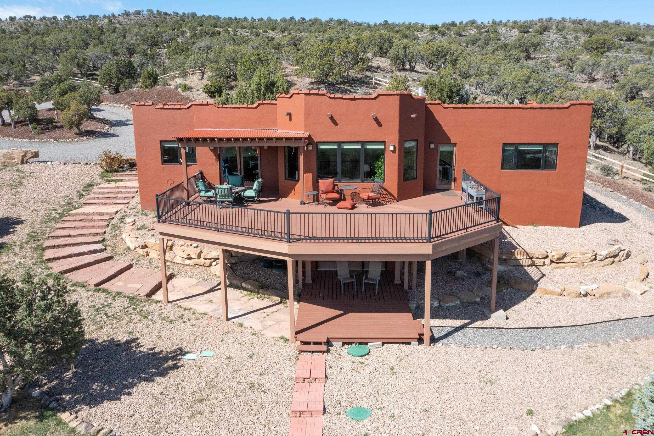 an aerial view of a house with swimming pool