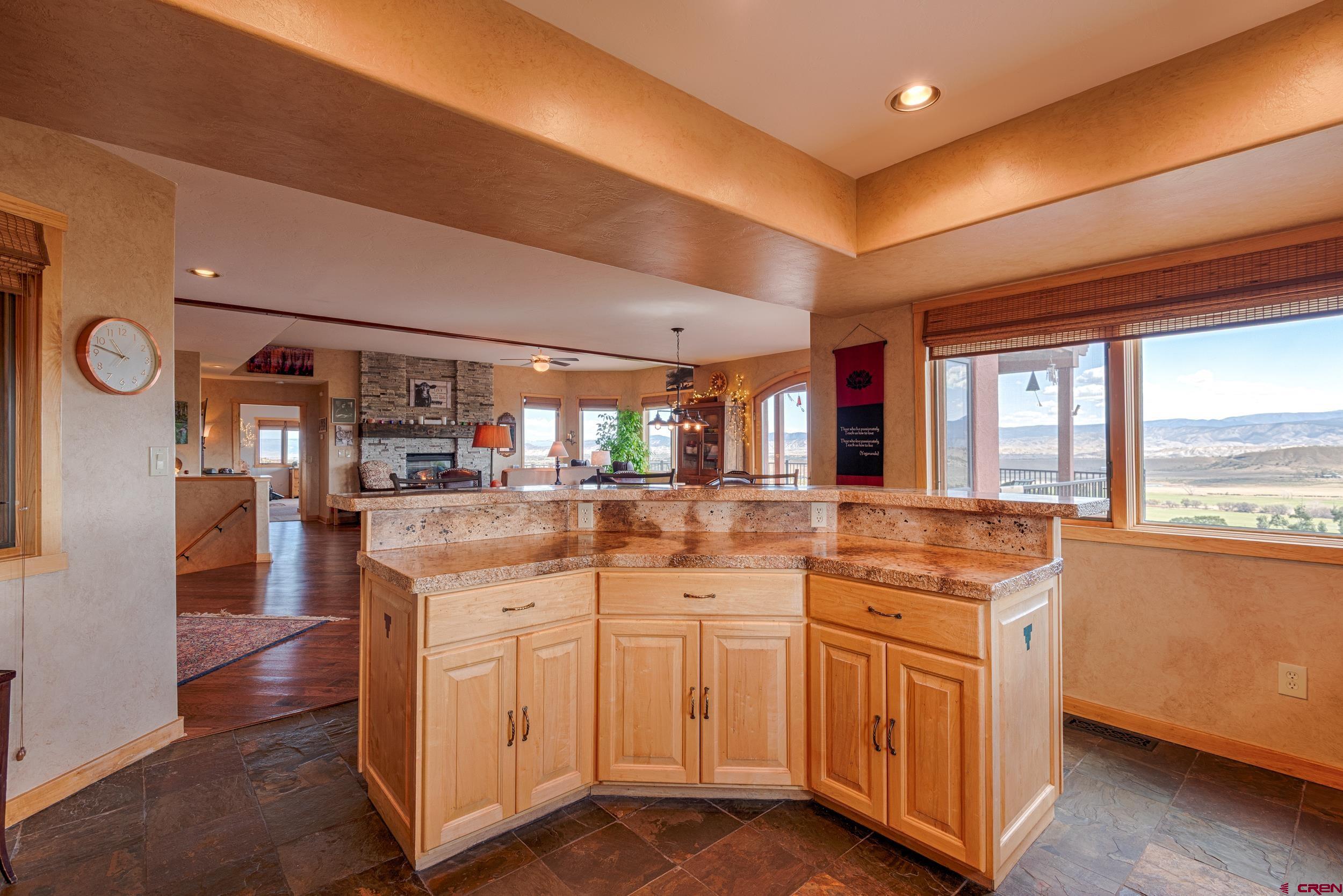 20891 Solitude Road Montrose, CO 81403 - Photo 12 of 39 a kitchen with white cabinets and sink
