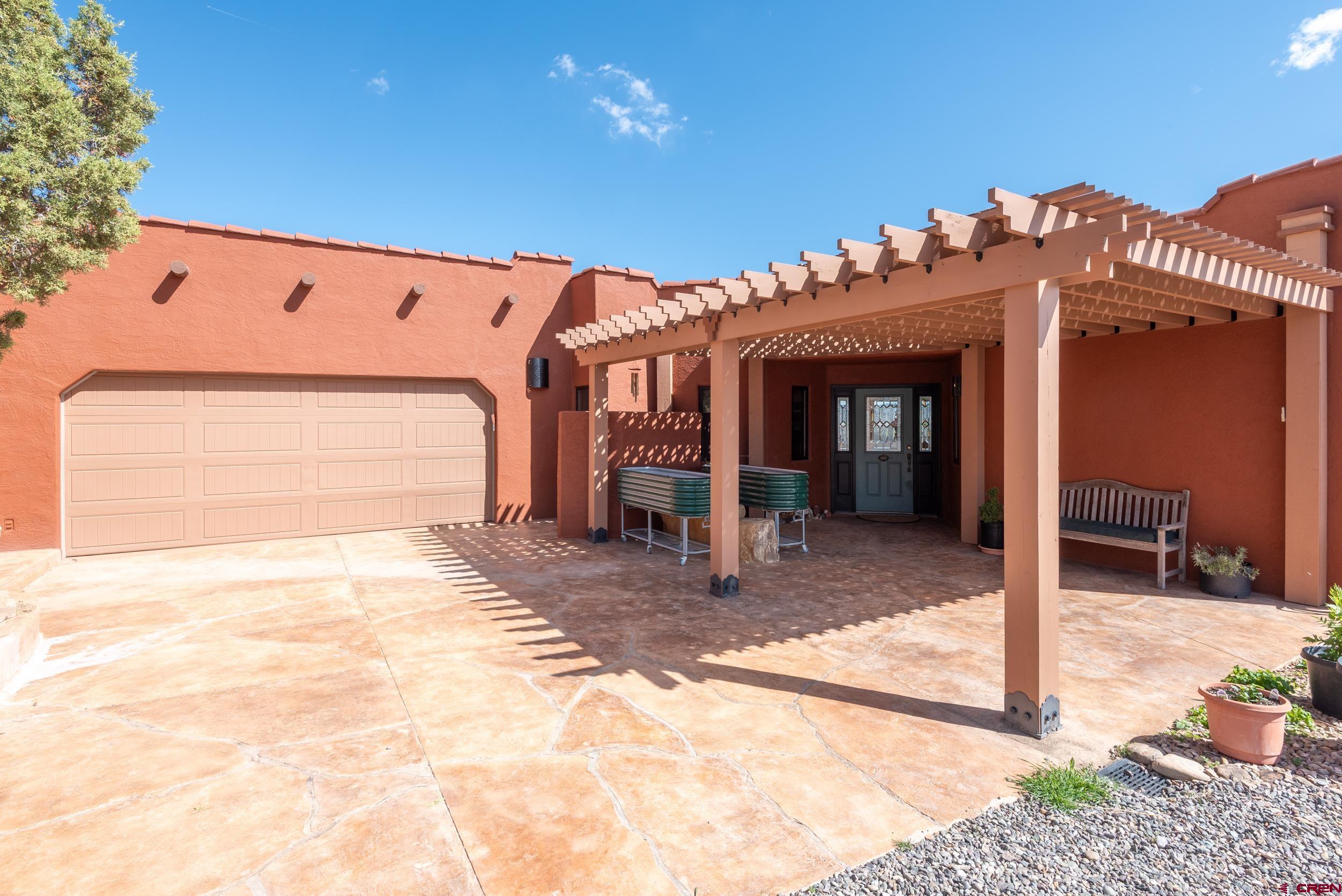 20891 Solitude Road Montrose, CO 81403 - Photo 2 of 39 a view of a building with a outdoor space