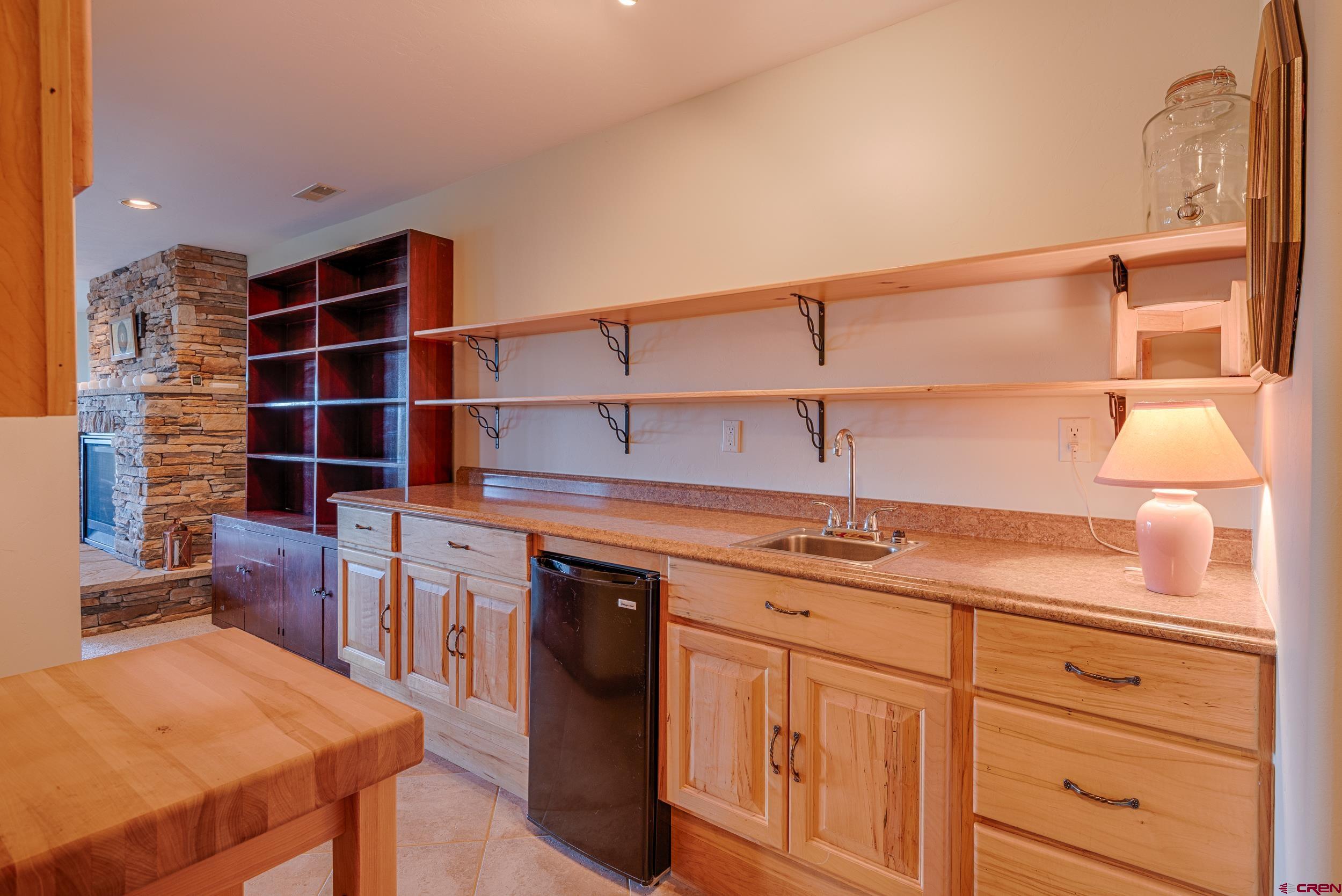 20891 Solitude Road Montrose, CO 81403 - Photo 26 of 39 a kitchen with a sink cabinets and window
