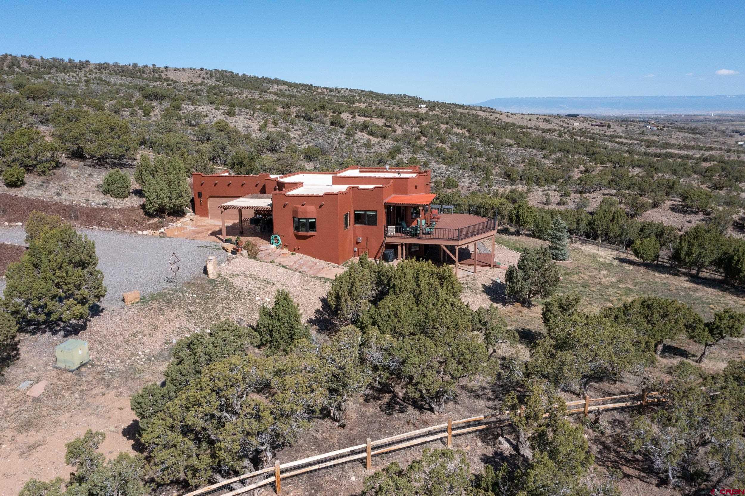 20891 Solitude Road Montrose, CO 81403 - Photo 28 of 39 an aerial view of a house with a yard
