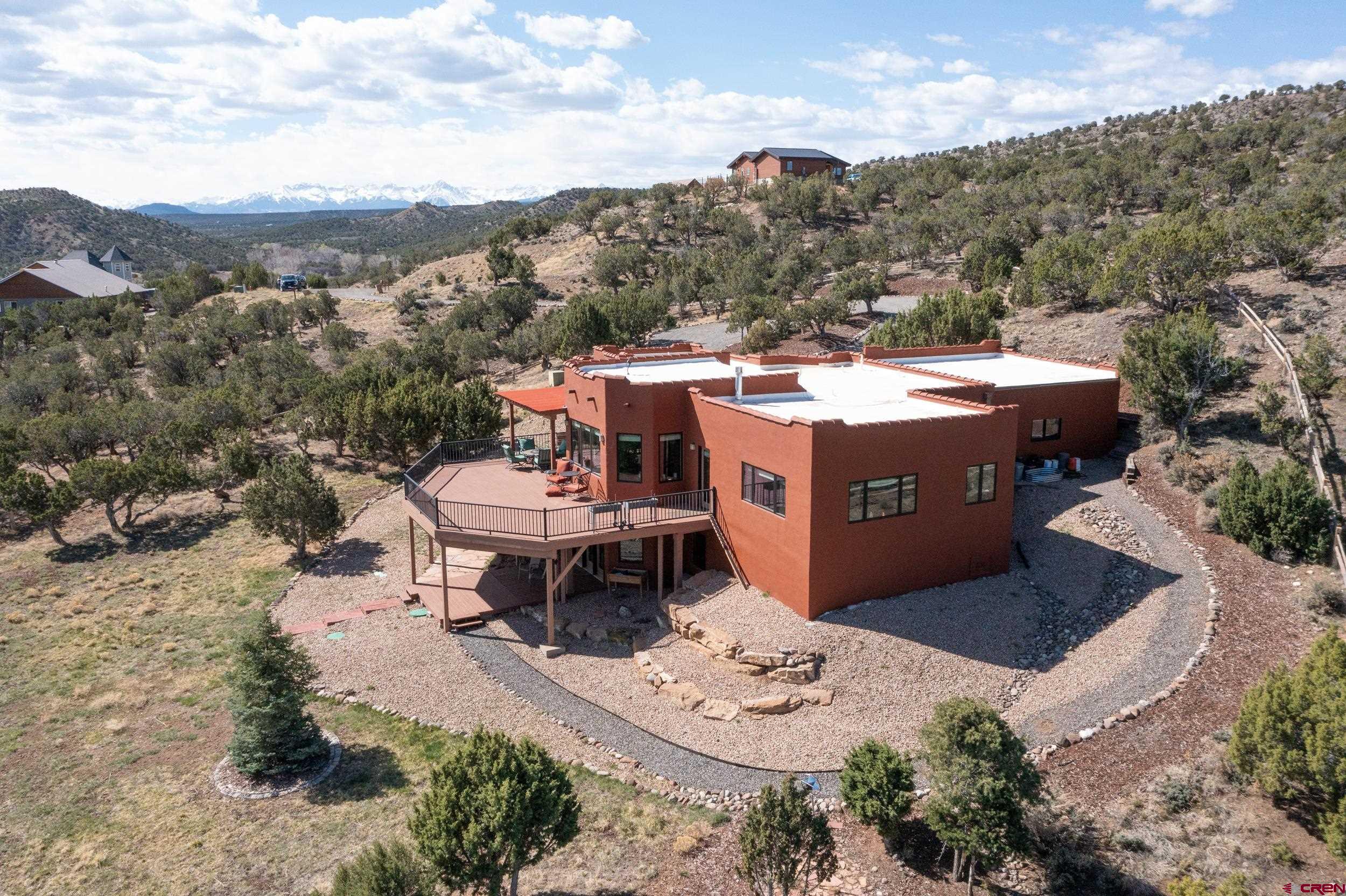 20891 Solitude Road Montrose, CO 81403 - Photo 31 of 39 a view of a terrace with a table and chairs