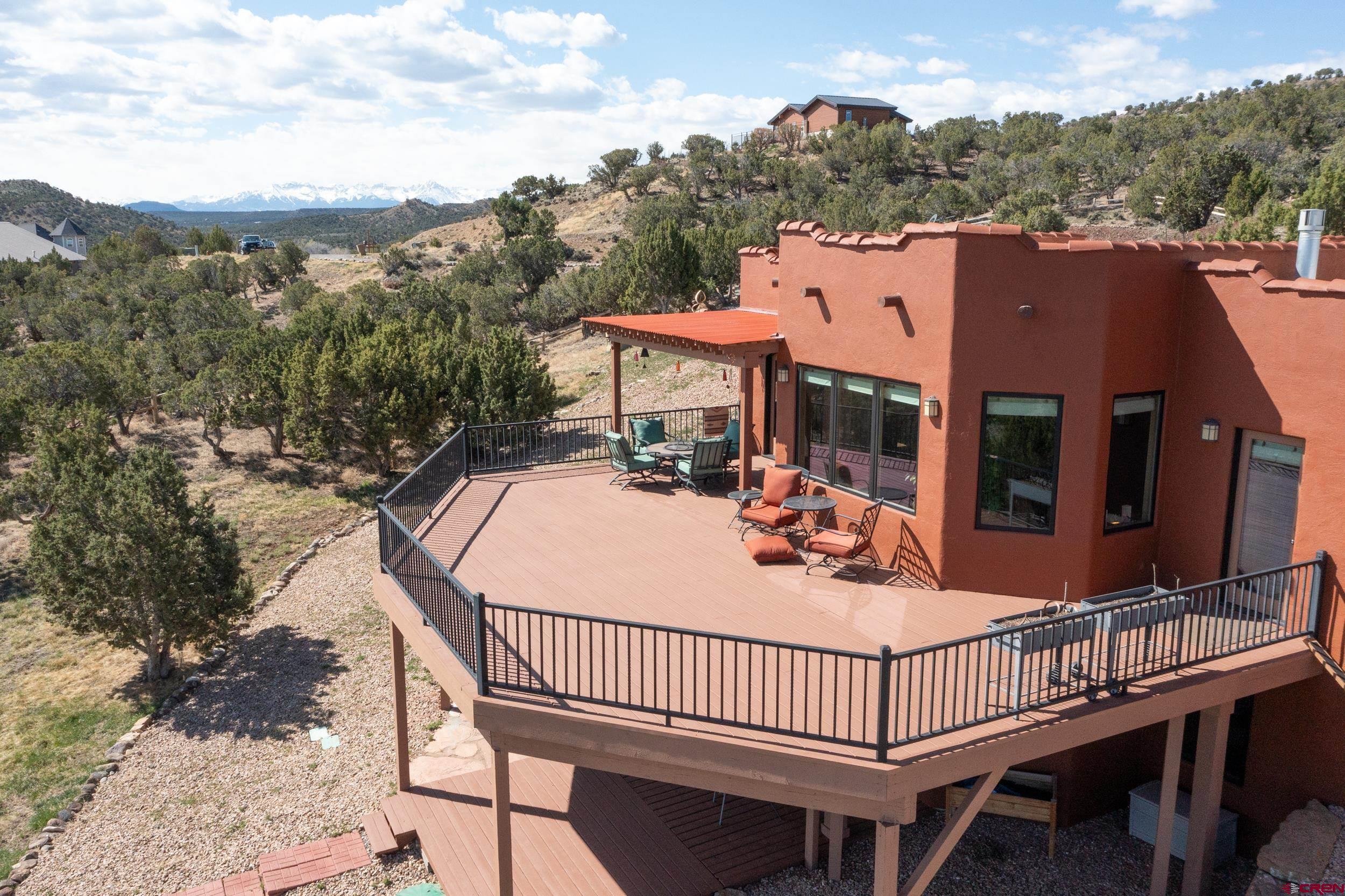 20891 Solitude Road Montrose, CO 81403 - Photo 32 of 39 a view of a roof deck with furniture